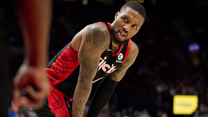 Portland Trail Blazers guard Damian Lillard talks to a referee during the second half against the Philadelphia 76ers at Moda Center.